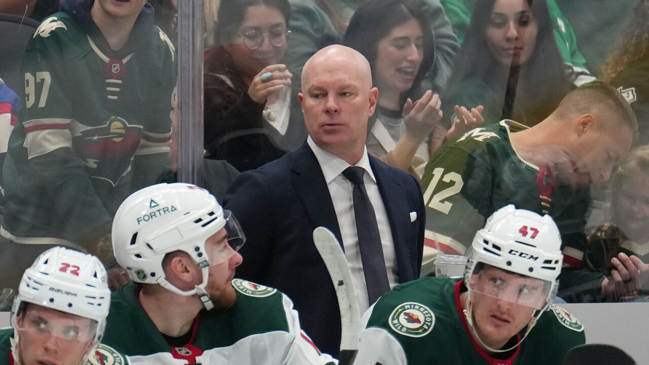 DALLAS, TX - APRIL 9: John Hynes watches the action from behind the bench against the Dallas Stars at the American Airlines Center on April 9, 2026 in Dallas, Texas.