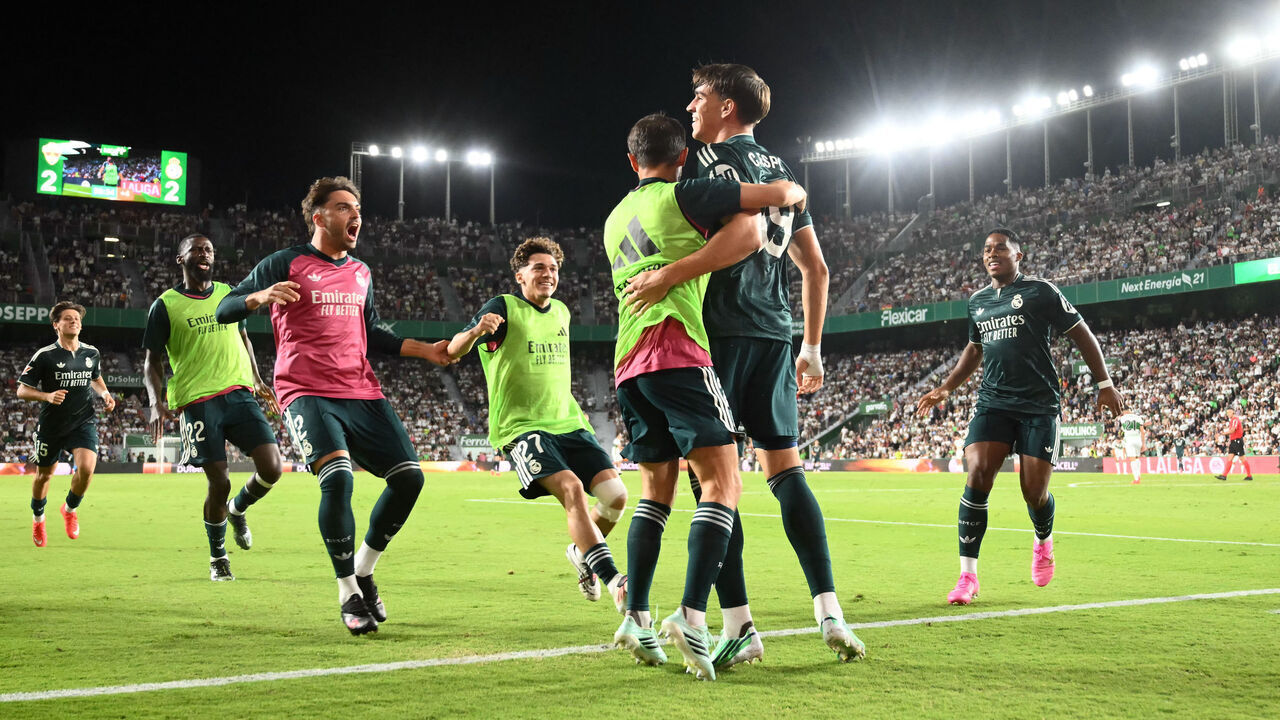 Real Madrid's Spanish forward #19 Carlos Espi Escrihuela (2R) celebrates with teammates after scoring his team's third goal during the Spanish league football match between Elche CF and Real Madrid CF at Martinez Valero Stadium in Elche on September 15, 2026.