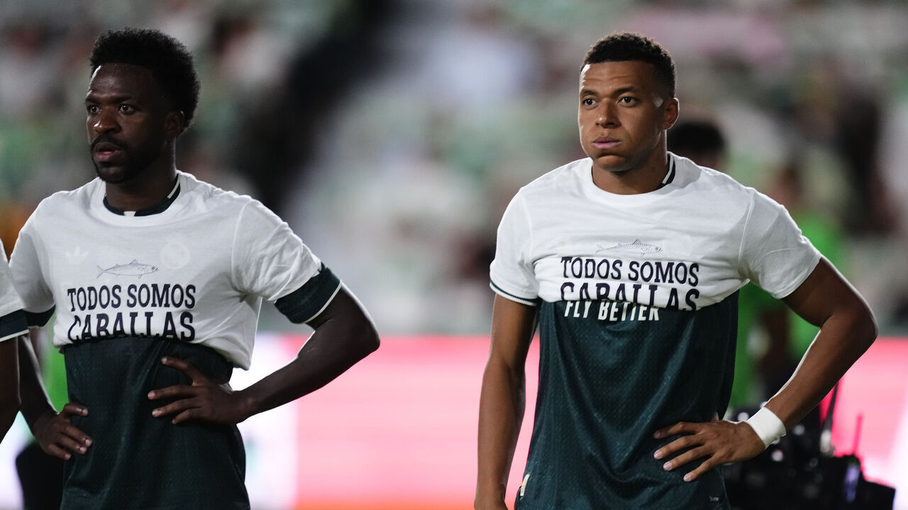 Vinicius Junior and Kylian Mbappe wearing T-shirts with rolled-up sleeves in support of Ceuta during the LaLiga EA Sports 2026/27 match between Elche CF and Real Madrid at Estadio Manuel Martinez Valero on September 15, 2026 in Elche, Spain.