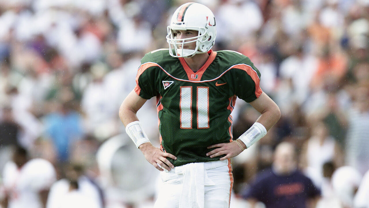 MIAMI - NOVEMBER 17: Quarterback Ken Dorsey #11 of the Miami Hurricanes stands on the field during the Big East Conference football game against the Syracuse Orangemen at the Orange Bowl on November 17, 2001 in Miami Florida. Miami won 59-0.