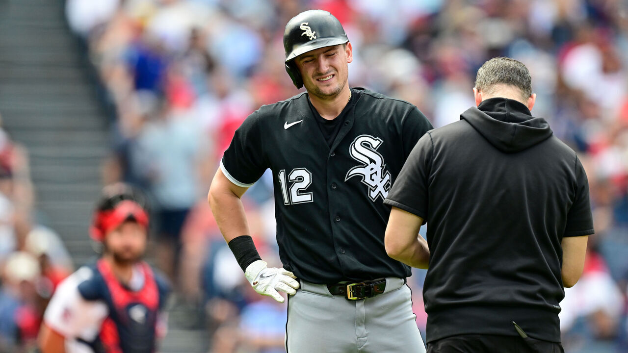 CLEVELAND, OHIO - SEPTEMBER 16: Colson Montgomery #12 of the Chicago White Sox is checked by a trainer after being hit by a pitch during the fourth inning against the Cleveland Guardians at Progressive Field on September 16, 2026 in Cleveland, Ohio.