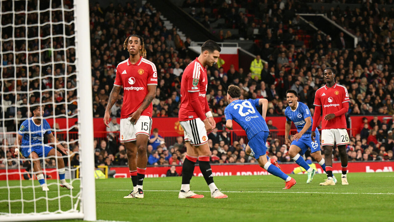Brighton's Belgian defender #29 Maxim De Cuyper celebrates scoring the team's third goal during the English League Cup third round football match between Manchester United and Brighton and Hove Albion at Old Trafford in Manchester, north west England, on September 16, 2026. / RESTRICTED TO EDITORIAL USE. No use with unauthorized audio, video, data, fixture lists, club/league logos or 'live' services. Online in-match use limited to 120 images. An additional 40 images may be used in extra time. No video emulation. Social media in-match use limited to 120 images. An additional 40 images may be used in extra time. No use in betting publications, games or single club/league/player publications. /