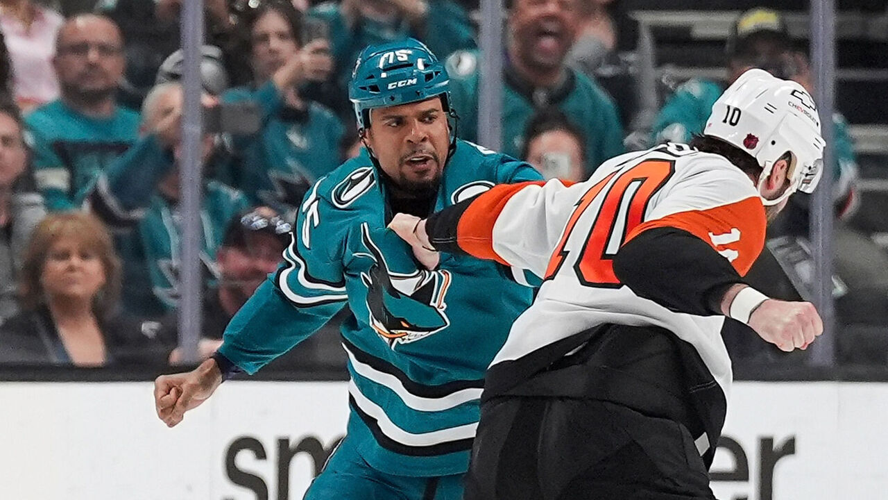 SAN JOSE, CA - MARCH 21: Ryan Reaves #75 of the San Jose Sharks fights against Garrett Wilson #10 of the Philadelphia Flyers during the first period at SAP Center on March 21, 2026 in San Jose, California.