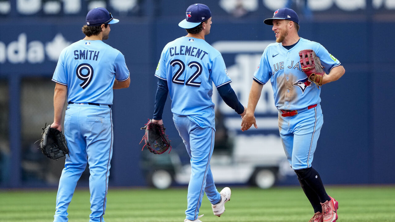 TORONTO, CANADA - SEPTEMBER 16: Center fielder Myles Straw #3 of the Toronto Blue Jays celebrates with second baseman Ernie Clement #22 and second baseman Josh Smith #9 after defeating the Detroit Tigers at Rogers Centre on September 16, 2026 in Toronto, Canada.