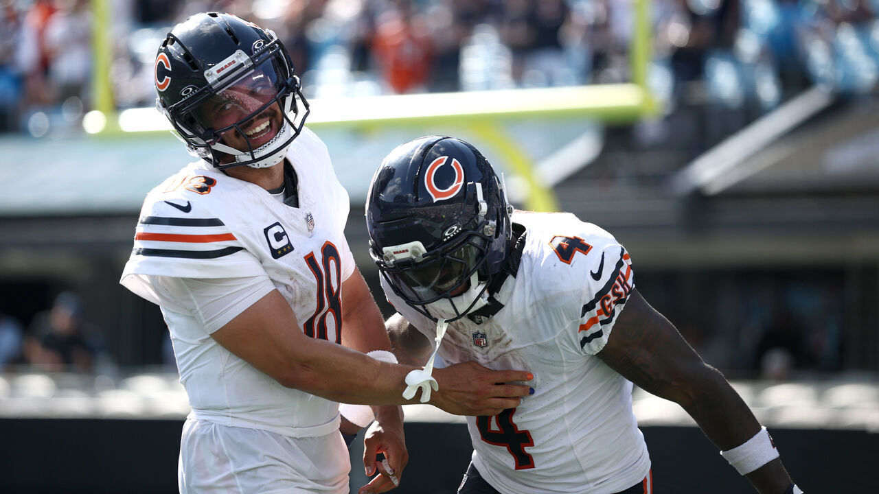 CHARLOTTE, NORTH CAROLINA - SEPTEMBER 13: Caleb Williams #18 of the Chicago Bears reacts to touchdown against the Carolina Panthers with D'Andre Swift #4 during the fourth quarter of the game at Bank of America Stadium on September 13, 2026 in Charlotte, North Carolina.