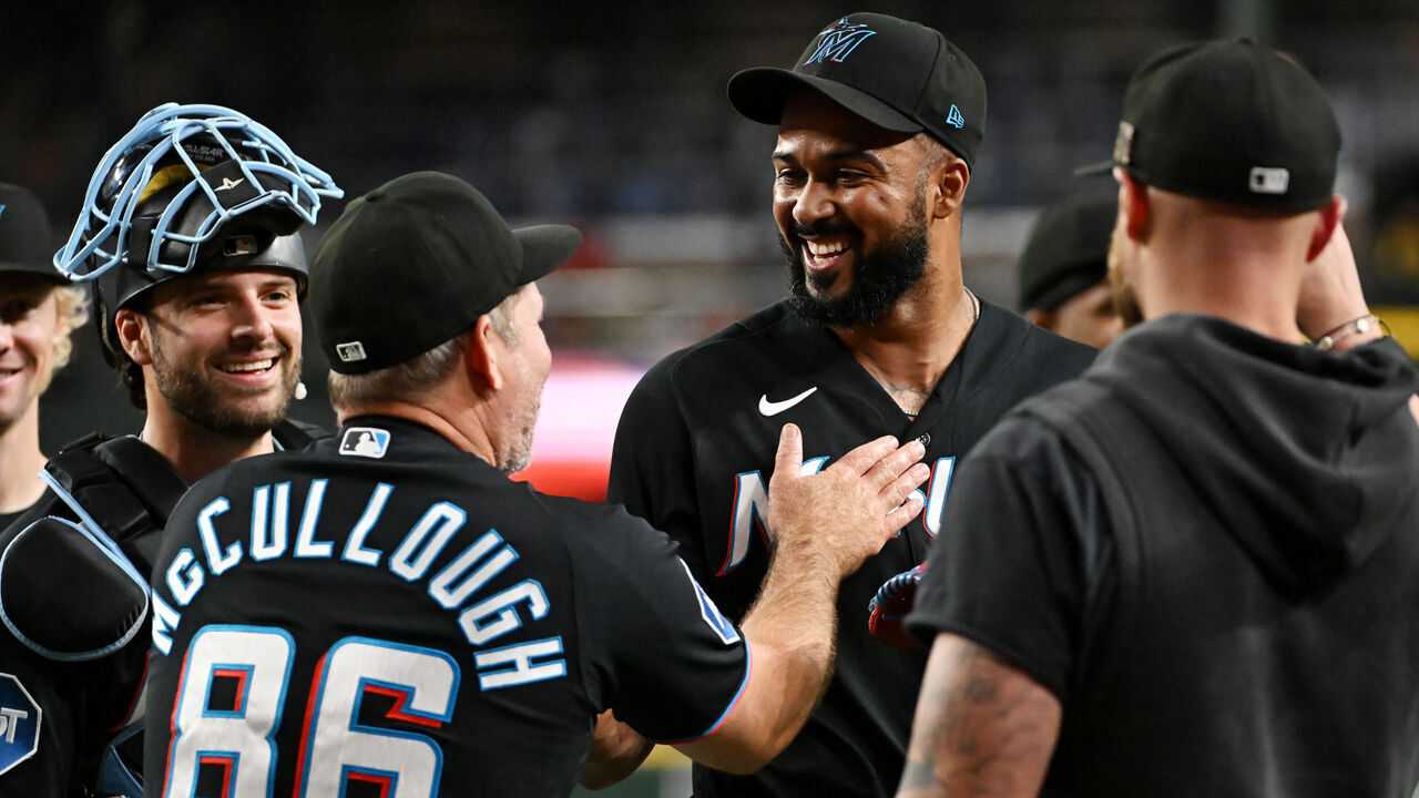 PHOENIX, ARIZONA - SEPTEMBER 16: Sandy Alcantara #22 of the Miami Marlins celebrates with manager Clayton McCullough #86 after getting a save against the Arizona Diamondbacks during the ninth inning at Chase Field on September 16, 2026 in Phoenix, Arizona. Marlins won 4-3.