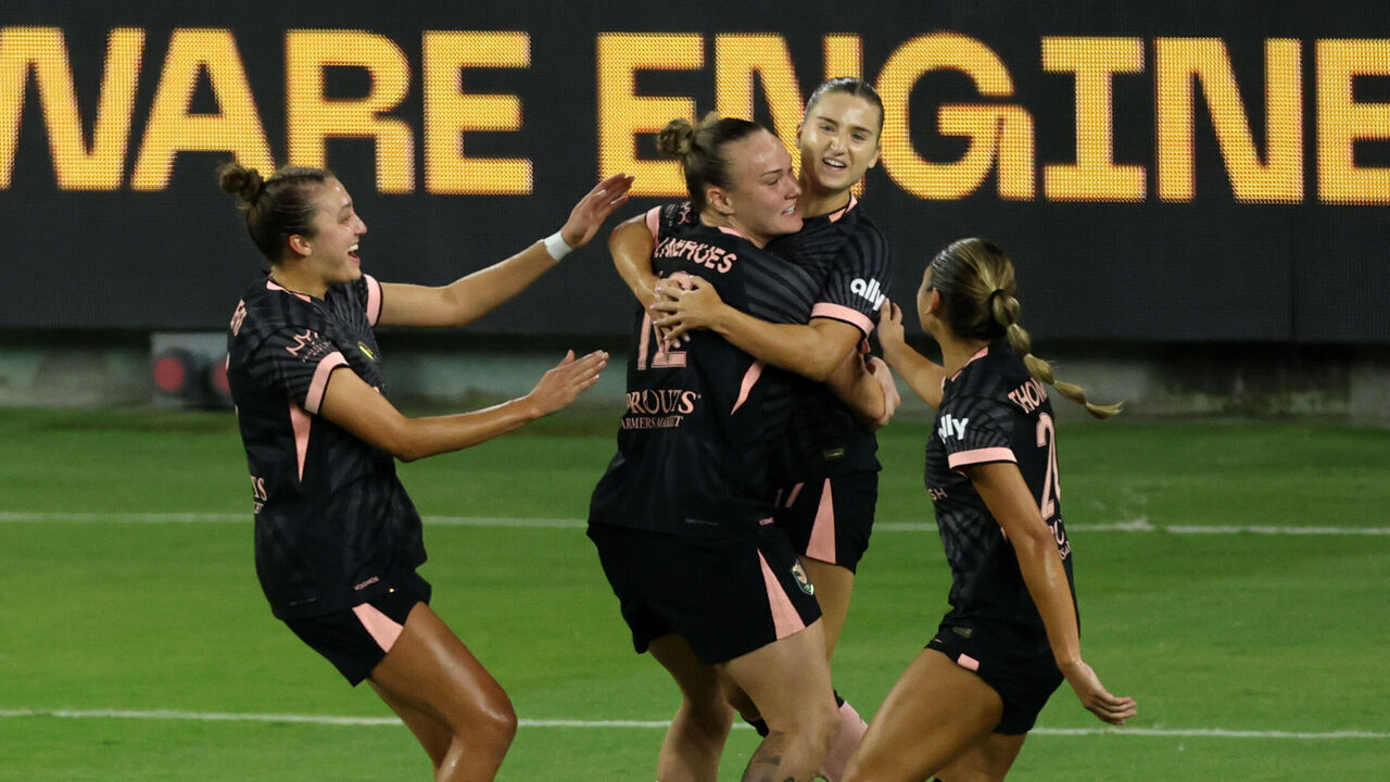 LOS ANGELES, CALIFORNIA - SEPTEMBER 16: Ally Sentnor #17 of Angel City FC celebrates scoring the team's first goal with teammates during the NWSL match between Angel City FC and Seattle Reign at BMO Stadium on September 16, 2026 in Los Angeles, California.