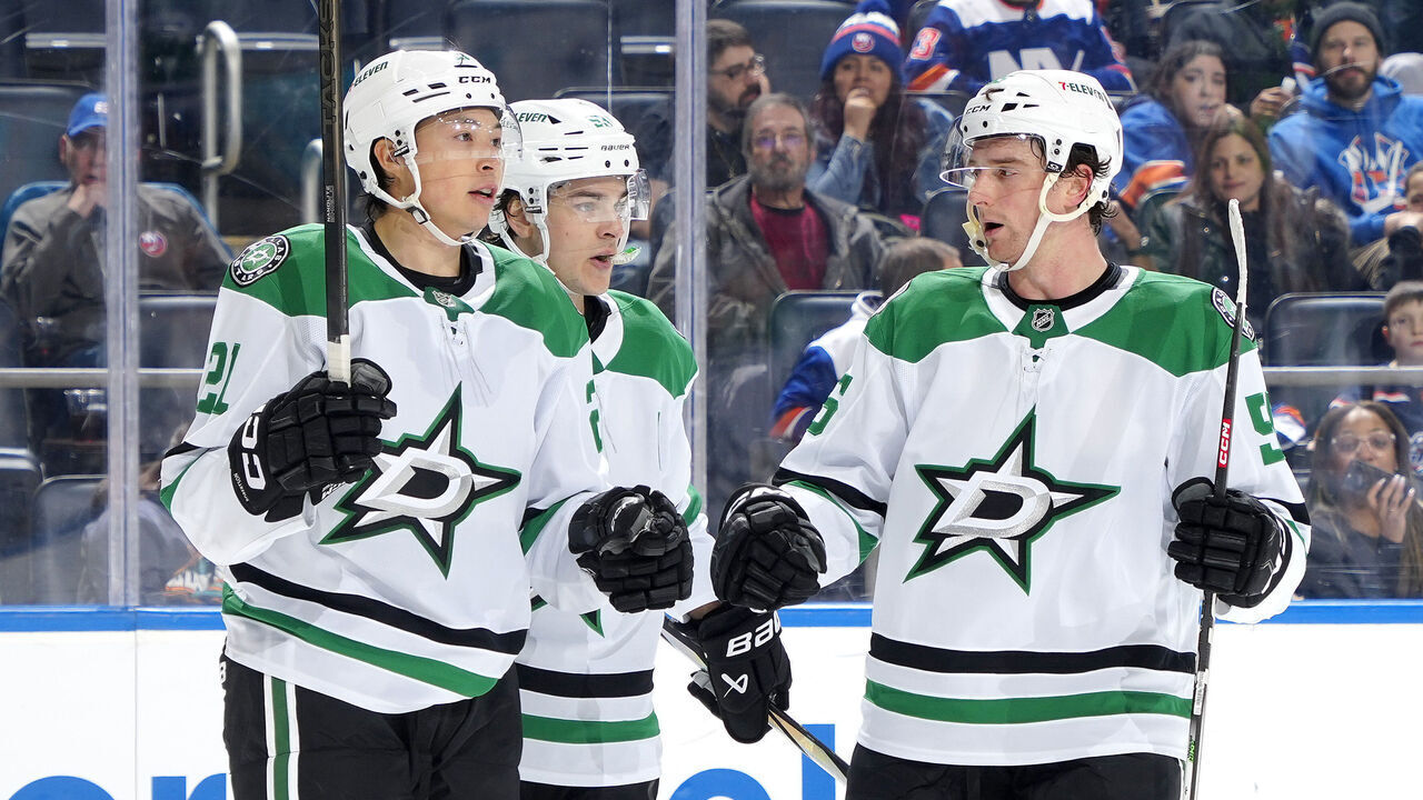 ELMONT, NEW YORK - FEBRUARY 23: Jason Robertson #21 of the Dallas Stars is congratulated by Wyatt Johnston #53 and Thomas Harley #55 after scoring his second goal against the New York Islanders during the second period at UBS Arena on February 23, 2025 in Elmont, New York.