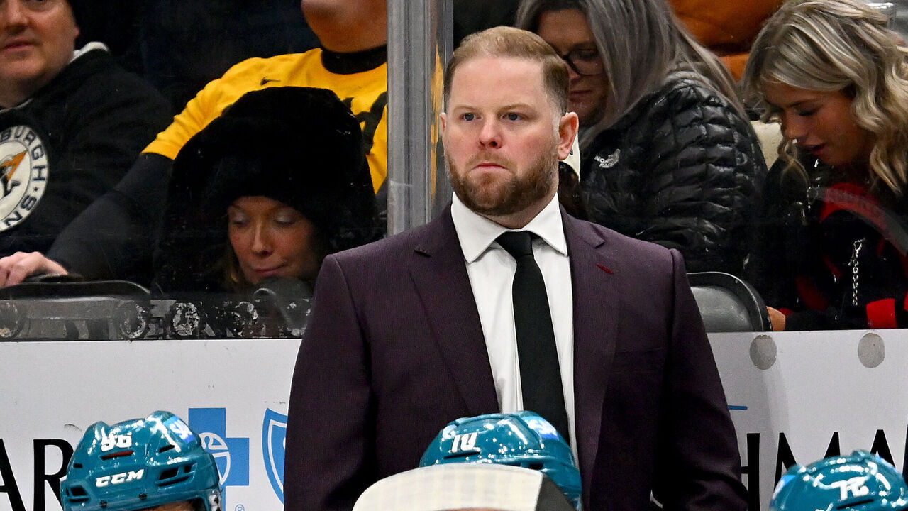 PITTSBURGH, PA - DECEMBER 13: Ryan Warsofsky of the San Jose Sharks looks on against the Pittsburgh Penguins at PPG PAINTS Arena on December 13, 2025 in Pittsburgh, Pennsylvania.