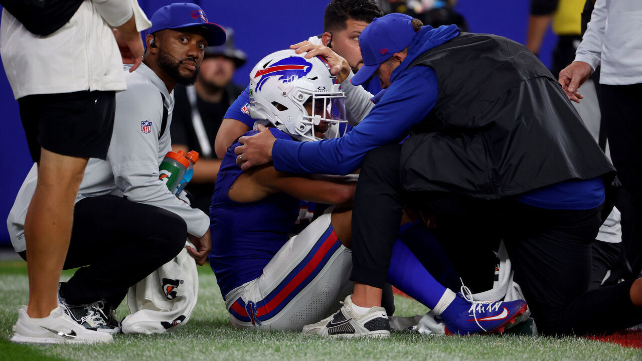 ORCHARD PARK, NEW YORK - SEPTEMBER 17: DJ Moore #2 of the Buffalo Bills is looked over by staff after a play against the Detroit Lions during the second quarter of the game at Highmark Stadium on September 17, 2026 in Orchard Park, New York.