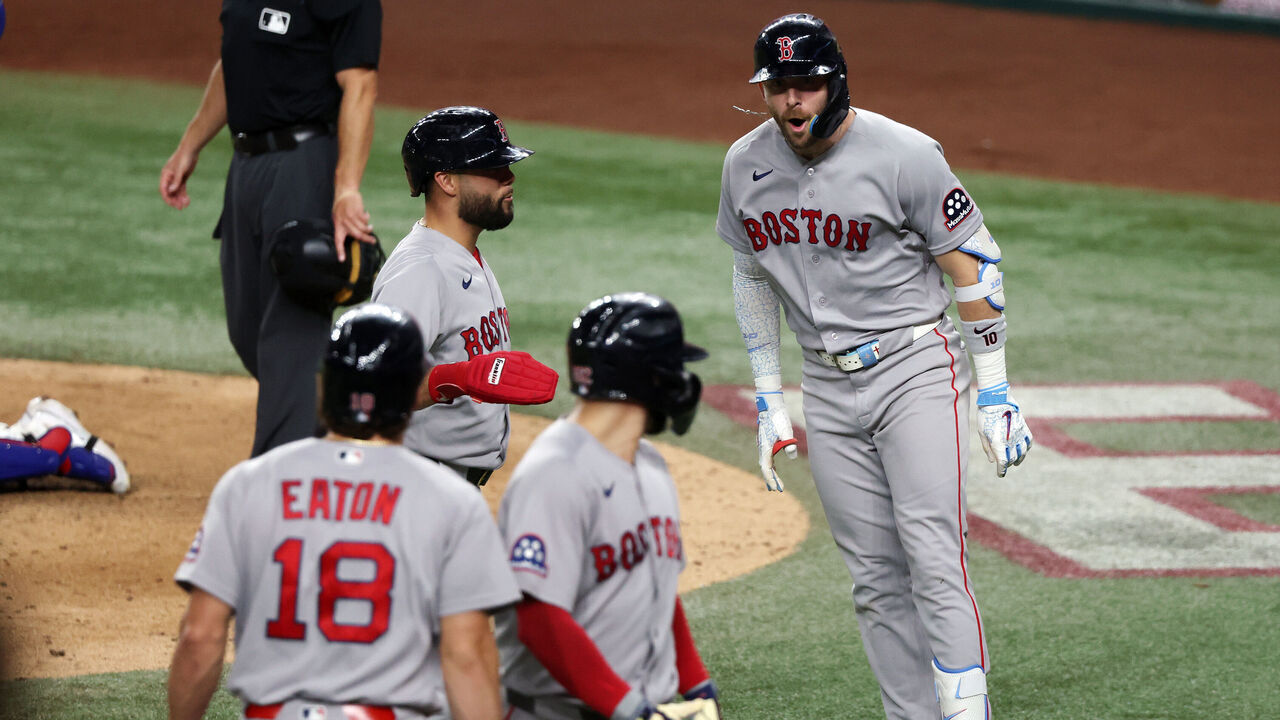 ARLINGTON, TEXAS - SEPTEMBER 17: Trevor Story #10 of the Boston Red Sox (R) celebrates after a three-run home run against the Texas Rangers in the eighth inning at Globe Life Field on September 17, 2026 in Arlington, Texas.