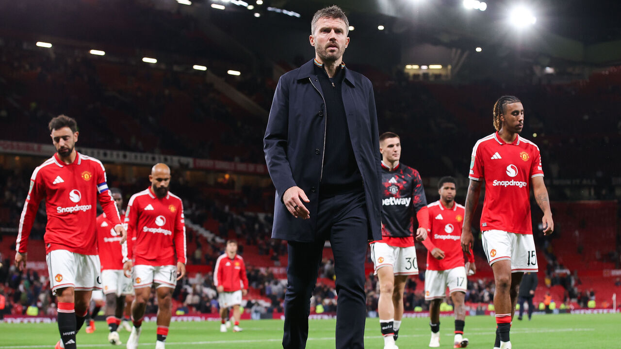 MANCHESTER, ENGLAND - SEPTEMBER 16: Michael Carrick, head coach of Manchester United, looks on as he leaves the pitch to boos ahead of his players after the Carabao Cup Third Round match between Manchester United and Brighton & Hove Albion at Old Trafford on September 16, 2026 in Manchester, England.