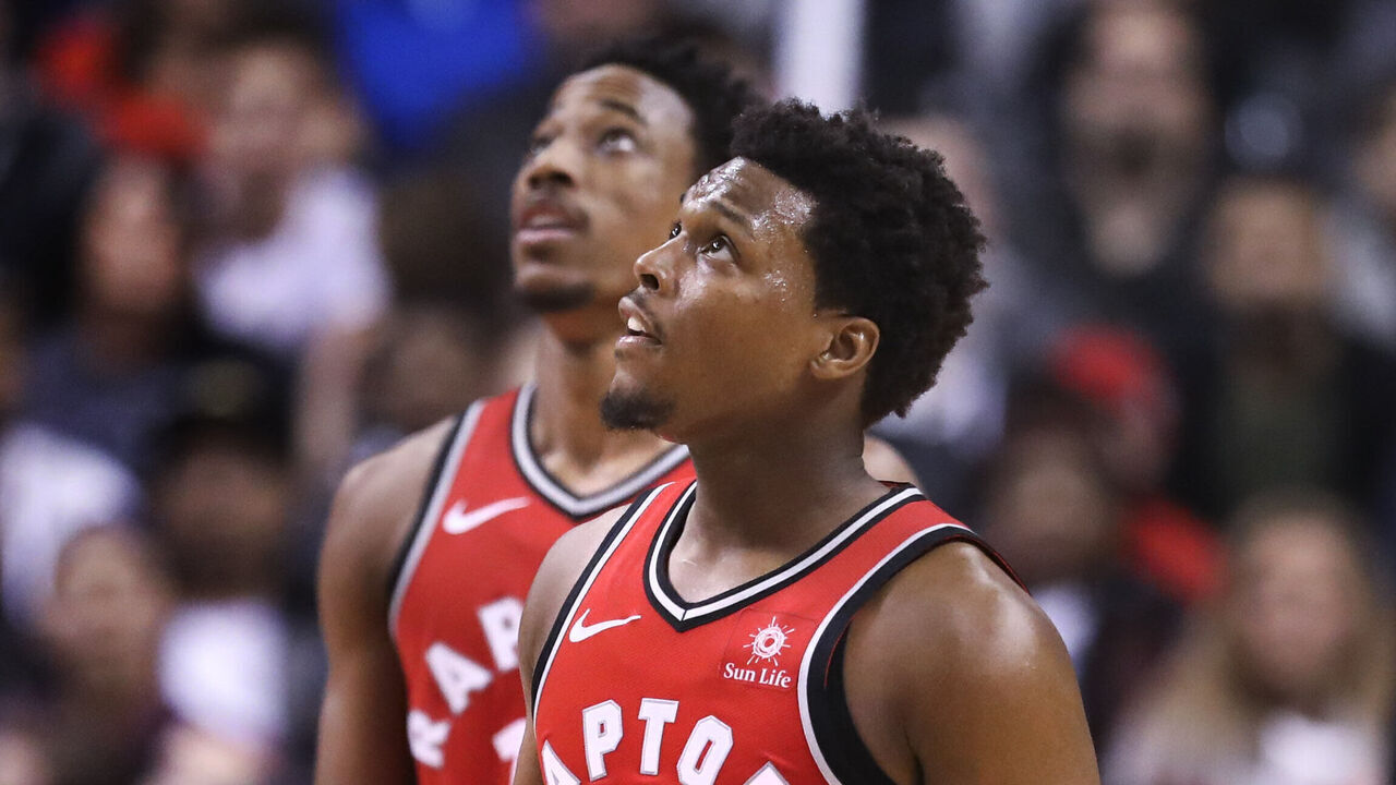TORONTO, ON - March 25 In second half action, both Toronto Raptors guard Kyle Lowry (7) and DeMar DeRozan look up to the scoreboard to watch a replay of a foul. The Toronto Raptors lost to the LA Clippers 117-106 in NBA basketball action at the Air Canada Centre (ACC) in Toronto. {man} 25, 2018 (Richard Lautens/Toronto Star via Getty Images)