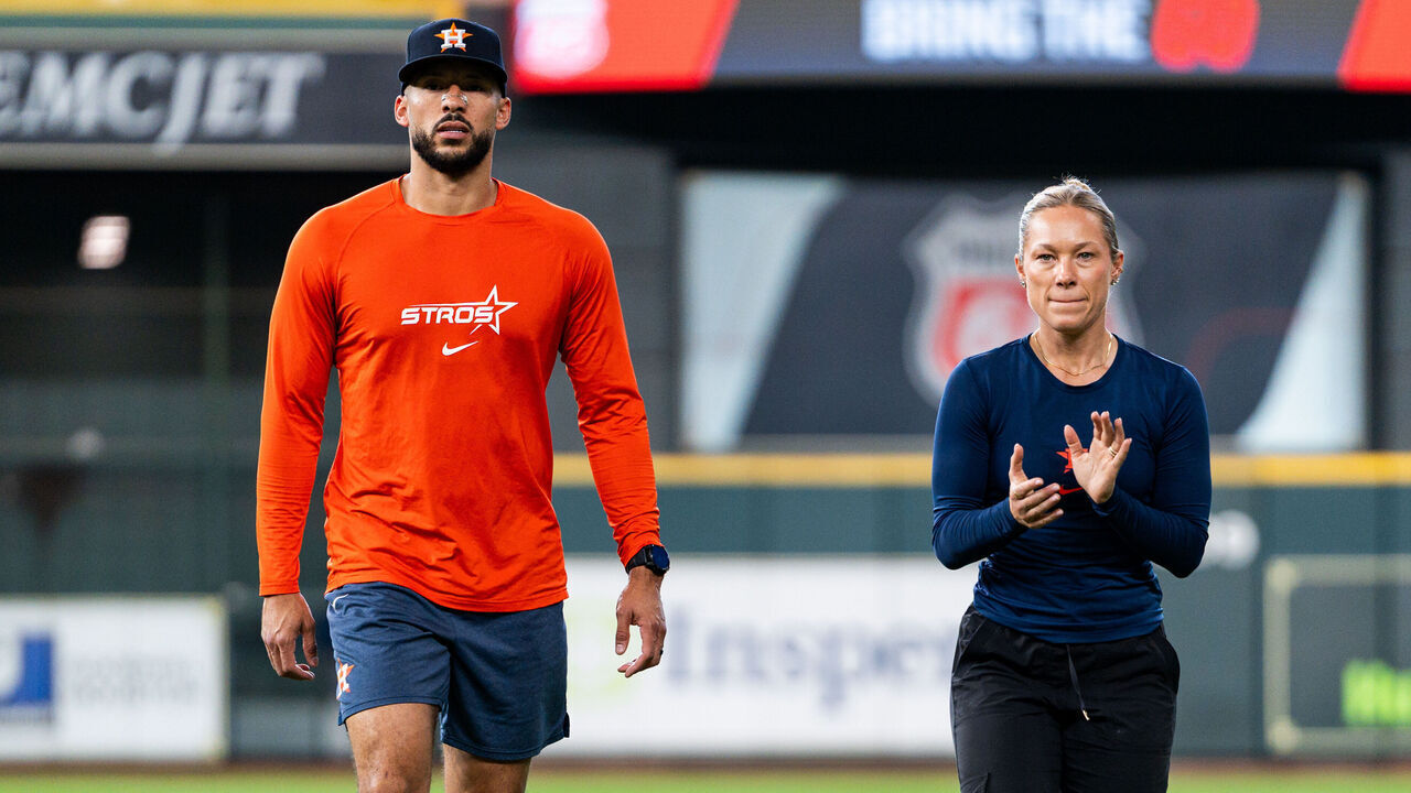 HOUSTON, TEXAS - AUGUST 01: Carlos Correa #1 of the Houston Astros works out with strength and conditioning coach Stephanie Mock Grubbs before the game against the Texas Rangers at Daikin Park on August 01, 2026 in Houston, Texas.