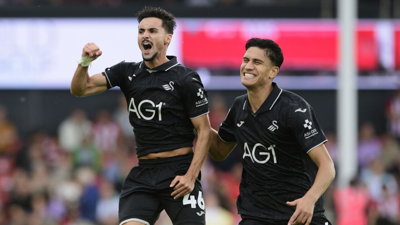 LINCOLN, ENGLAND - SEPTEMBER 19: Stephen Eustaquio of Swansea City, left, celebrates scoring his side's second goal with team-mate Marko Stamenic during the Sky Bet Championship 2026/27 match between Lincoln City and Swansea City at ProAmpac Stadium on September 19, 2026 in Lincoln, United Kingdom.