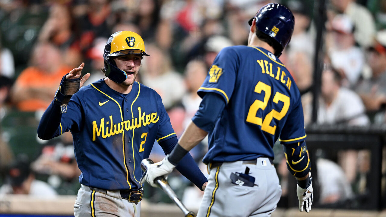 BALTIMORE, MARYLAND - SEPTEMBER 18: Brice Turang #2 of the Milwaukee Brewers celebrates with Christian Yelich #22 after scoring in the ninth inning against the Baltimore Orioles at Oriole Park at Camden Yards on September 18, 2026 in Baltimore, Maryland.