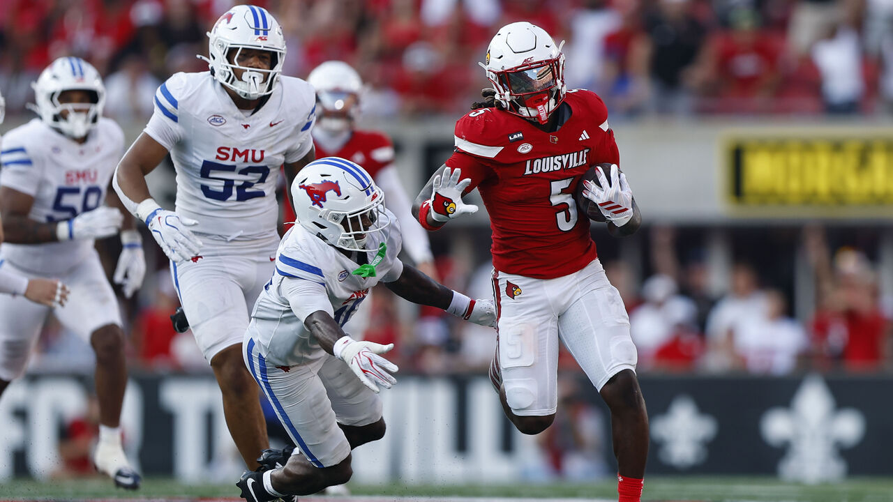 LOUISVILLE, KY - SEPTEMBER 19: Louisville Cardinals running back Keyjuan Brown (5) runs past SMU Mustangs safety Tyren Polley Jr. (10) in the second half of play and goes in for the touchdown during a college football game between the SMU Mustangs and the Louisville Cardinals on September 19, 2026 at L&N Federal Credit Union Stadium in Louisville, KY.