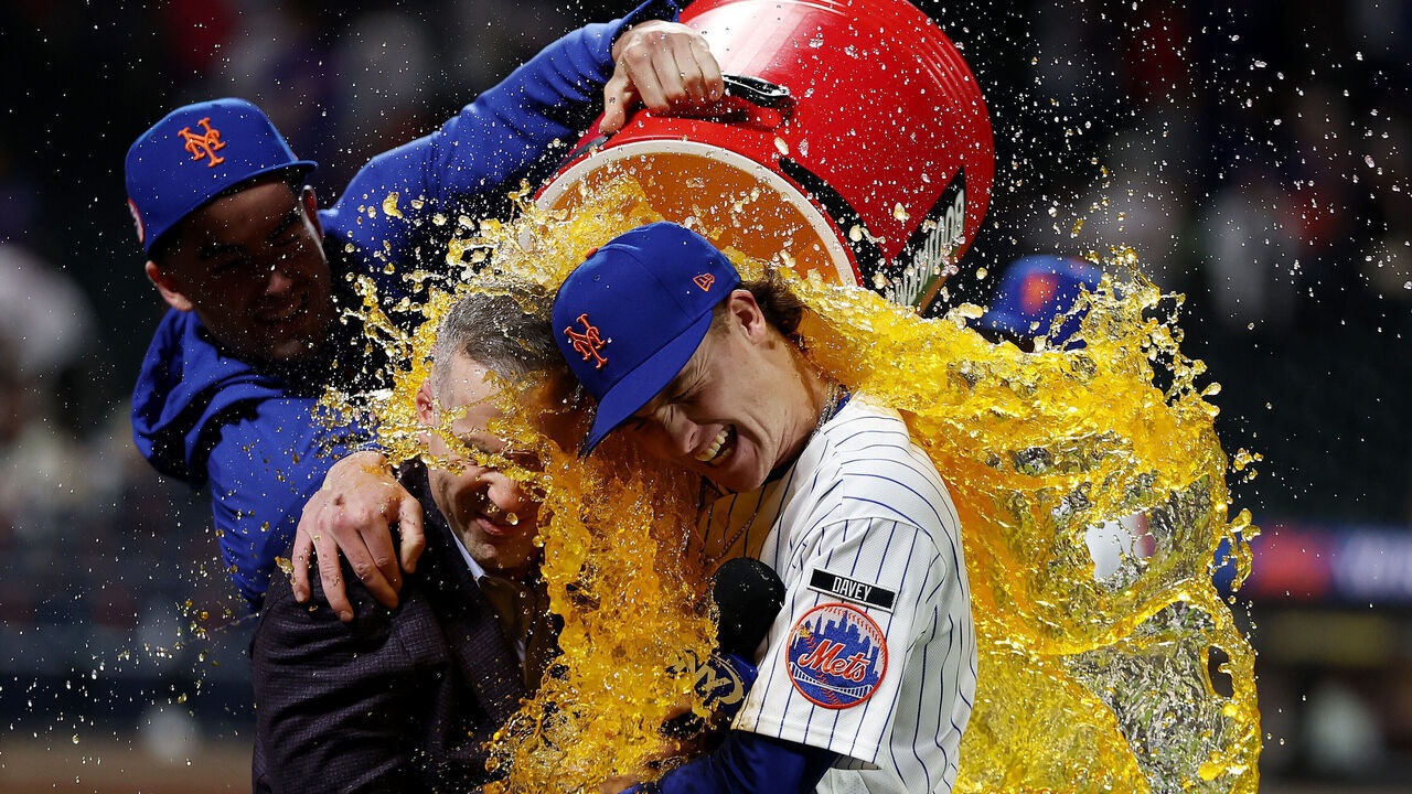 NEW YORK, NEW YORK - SEPTEMBER 19: Carson Benge #3 of the New York Mets is doused with gatorade after breaking the New York Mets rookie hits record with 156 after their 10-3 win against the Philadelphia Phillies game at Citi Field on September 19, 2026 in New York City.