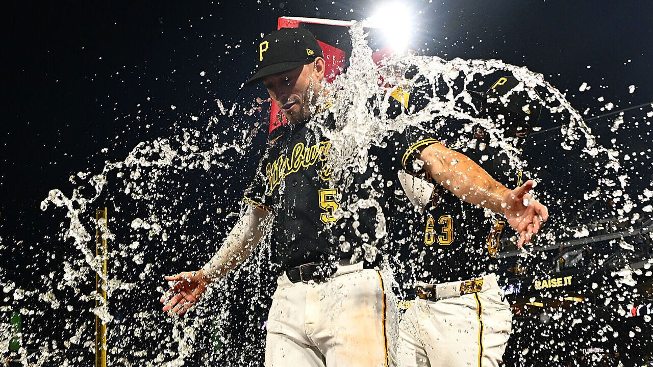 PITTSBURGH, PENNSYLVANIA - SEPTEMBER 19: Brandon Lowe #5 of the Pittsburgh Pirates gets water dumped on him by Ronny Simon #63 of the Pittsburgh Pirates following a 6-5 win over the Kansas City Royals during the game at PNC Park on September 19, 2026 in Pittsburgh, Pennsylvania.