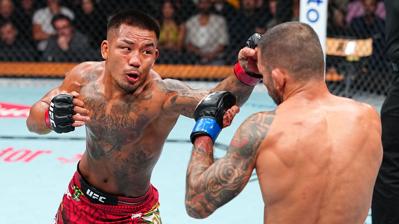 LOS ANGELES, CALIFORNIA - SEPTEMBER 19: Joshua Van of Myanmar punches Alexandre Pantoja of Brazil in the UFC flyweight championship fight during the UFC 331 event at Crypto.com Arena on September 19, 2026 in Los Angeles, California.