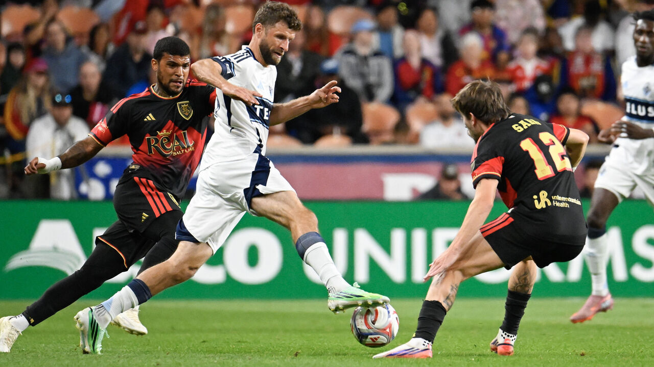 SANDY, UTAH - SEPTEMBER 19: Thomas Müller #13 of the Vancouver Whitecaps FC drives around Saba Lobjanidze #12 of the Real Salt Lake during the first half of an MLS game between Real Salt Lake and Vancouver Whitecaps FC at America First Field on September 19, 2026 in Sandy, Utah.