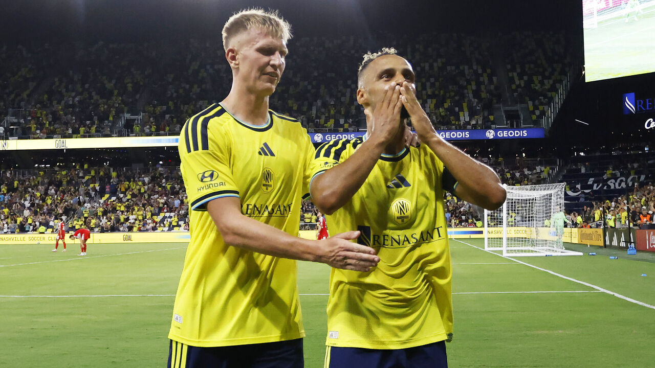 NASHVILLE, TENNESSEE - SEPTEMBER 19: Hany Mukhtar #10 and Sam Surridge #9 of the Nashville SC celebrate after a goal during the second half of the match against the Chicago Fire FC at GEODIS Park on September 19, 2026 in Nashville, Tennessee.