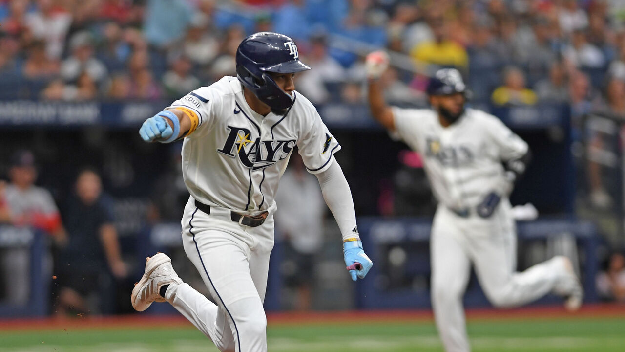 ST PETERSBURG, FLORIDA - SEPTEMBER 20: Chandler Simpson #14 of the Tampa Bay Rays celebrates knocking in Junior Caminero #13 of the Tampa Bay Rays during the first inning against the Boston Red Sox at Tropicana Field on September 20, 2026 in St Petersburg, Florida.