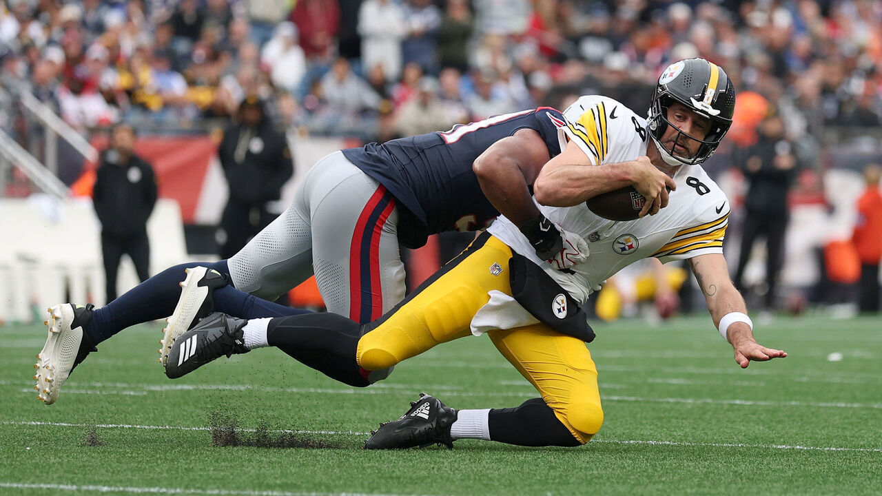 FOXBOROUGH, MASSACHUSETTS - SEPTEMBER 20: Aaron Rodgers #8 of the Pittsburgh Steelers is tackled by Elijah Ponder #91 of the New England Patriots during the fourth quarter of the game at Gillette Stadium on September 20, 2026 in Foxborough, Massachusetts.