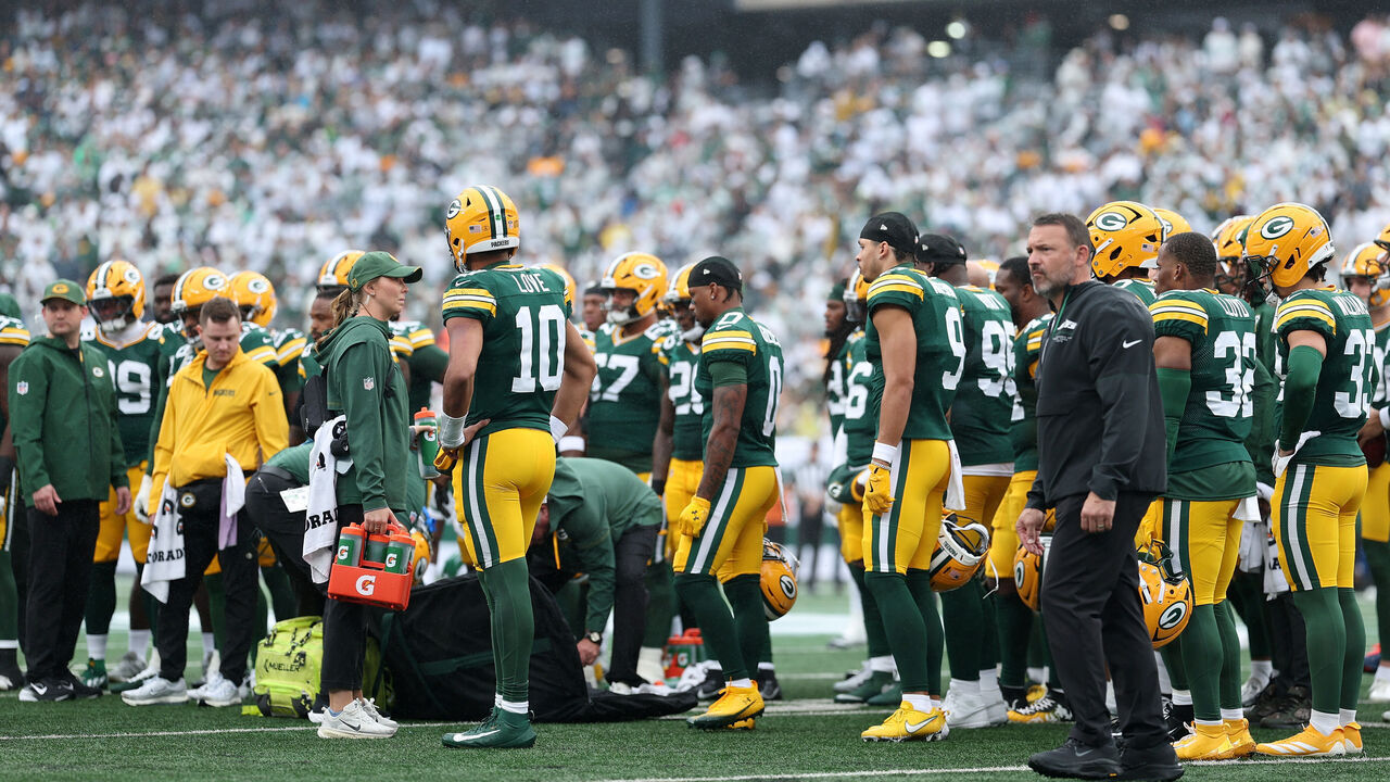 EAST RUTHERFORD, NEW JERSEY - SEPTEMBER 20: Players of the Green Bay Packers look over Jayden Reed #11 of the Green Bay Packers (not pictured) who is being looked at due to an injury against the New York Jets during the first half of the game at MetLife Stadium on September 20, 2026 in East Rutherford, New Jersey.