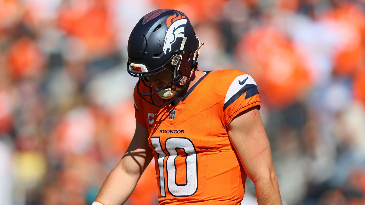 DENVER, COLORADO - SEPTEMBER 20: Bo Nix #10 of the Denver Broncos walks off the field during the second quarter of the game against the Jacksonville Jaguars at Empower Field At Mile High on September 20, 2026 in Denver, Colorado.