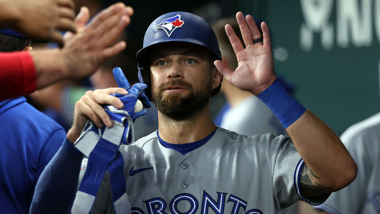 ARLINGTON, TEXAS - SEPTEMBER 20: Nathan Lukes #38 of the Toronto Blue Jays is greeted in the dugout after scoring in the seventh inning against the Texas Rangers at Globe Life Field on September 20, 2026 in Arlington, Texas.