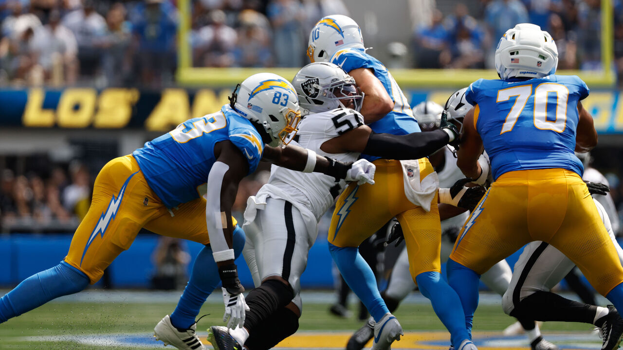 INGLEWOOD, CA - SEPTEMBER 20: Las Vegas Raiders defensive end Malcolm Koonce (51) sacks Los Angeles Chargers quarterback Justin Herbert (10) during the NFL game between the Las Vegas Raiders and the Los Angeles Chargers on September 20, 2026, at SoFi Stadium in Inglewood, CA.