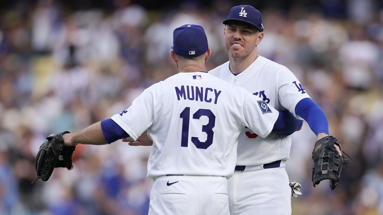 LOS ANGELES, CALIFORNIA - SEPTEMBER 20: Max Muncy #13 of the Los Angeles Dodgers and Freddie Freeman #5 celebrate after a baseball game against the San Francisco Giants at Dodger Stadium on September 20, 2026 in Los Angeles, California.