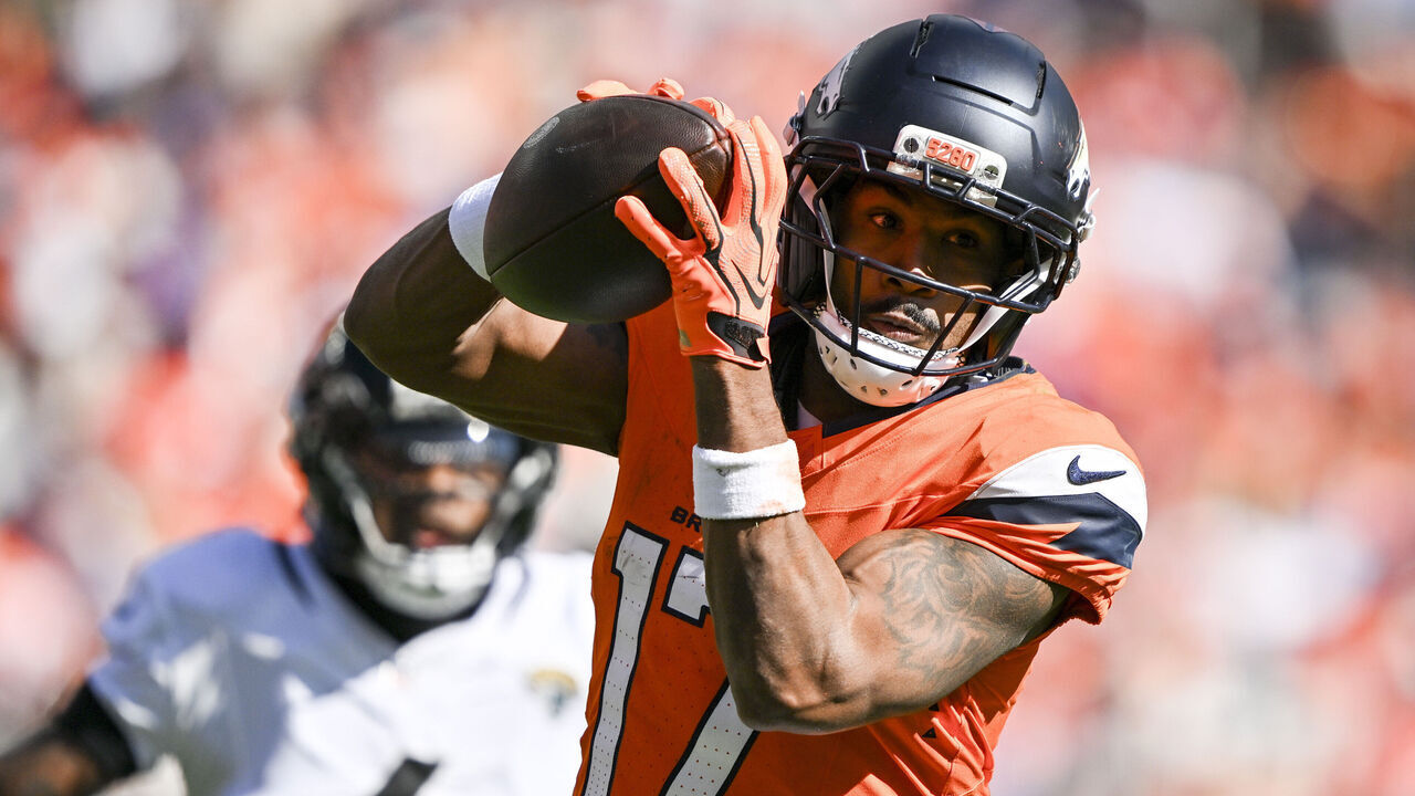 DENVER , CO - SEPTEMBER 20: Jaylen Waddle (17) of the Denver Broncos hauls in a pass as Jarrian Jones (4) of the Jacksonville Jaguars chases during the second quarter at Empower Field at Mile High in Denver, Colorado on Sunday, September 20, 2026.