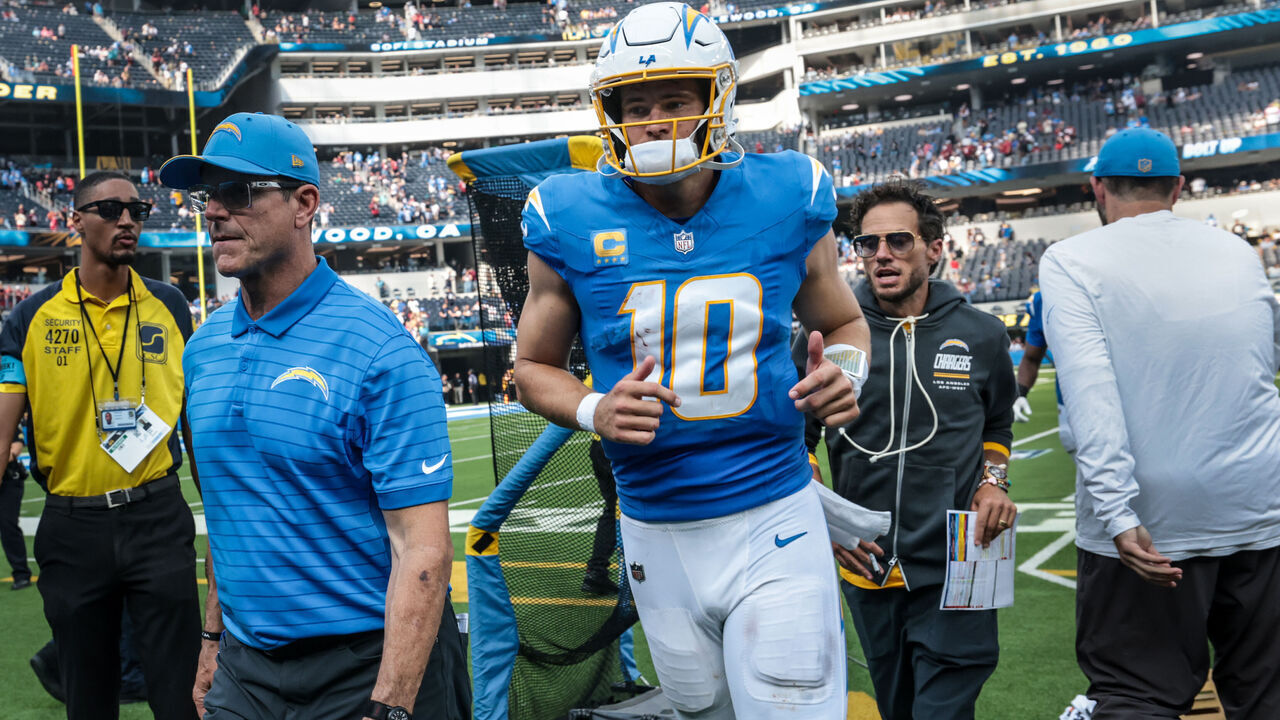 Inglewood, CA - September 13, 2026: Los Angeles Chargers head coach Jim Harbaugh, quarterback Justin Herbert and offensive coordinator Mike McDaniel leave the field after losing to the Arizona Cardinals at SoFi Stadium in Inglewood, CA on Sunday, Sept. 13, 2026. (Robert Gauthier/Los Angeles Times via Getty Images)
