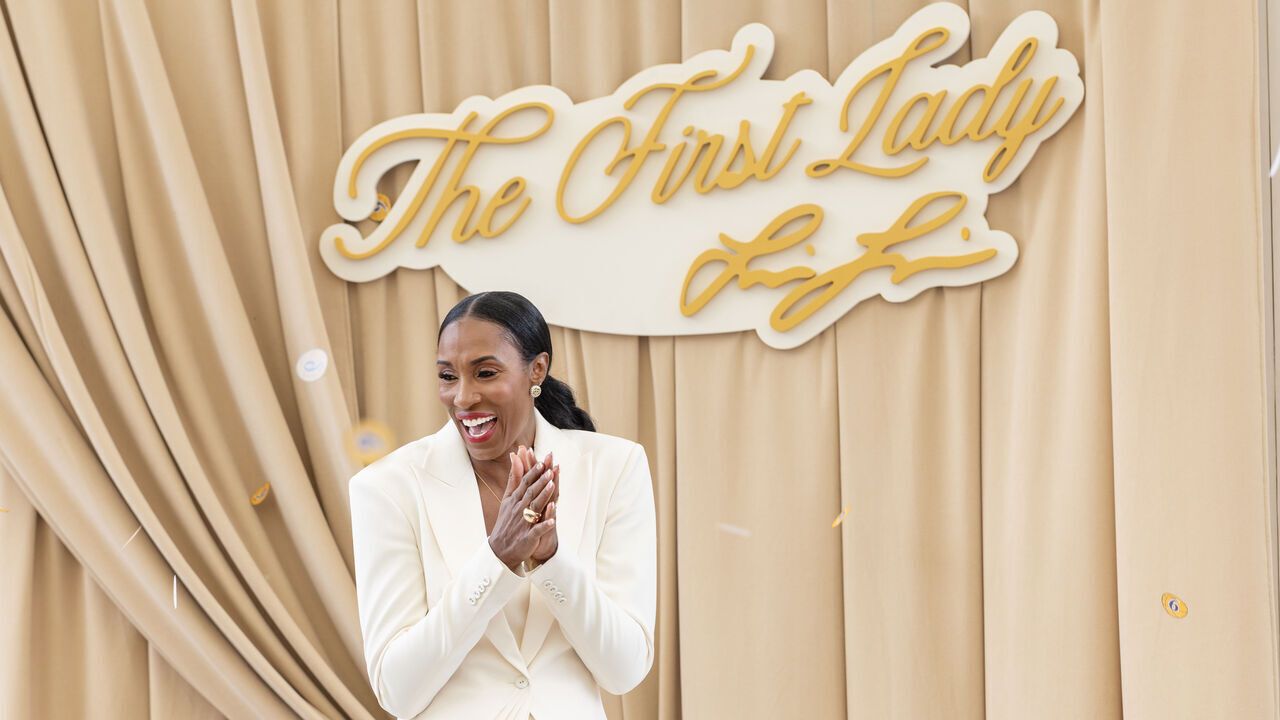 Los Angeles, CA. - September 20, 2026: Lisa Leslie celebrates on stage as her statue is unveiled at Star Plaza outside Crypto.com Arena on Sunday, Sept. 20, 2026 in Los Angeles, CA.. Leslie played for the Sparks from their inaugural 1997 season through 2009 and was a three-time recipient of the league's most valuable player award and led the Sparks to championships in 2001 and 2002.(Jason Armond / Los Angeles Times via Getty Images)