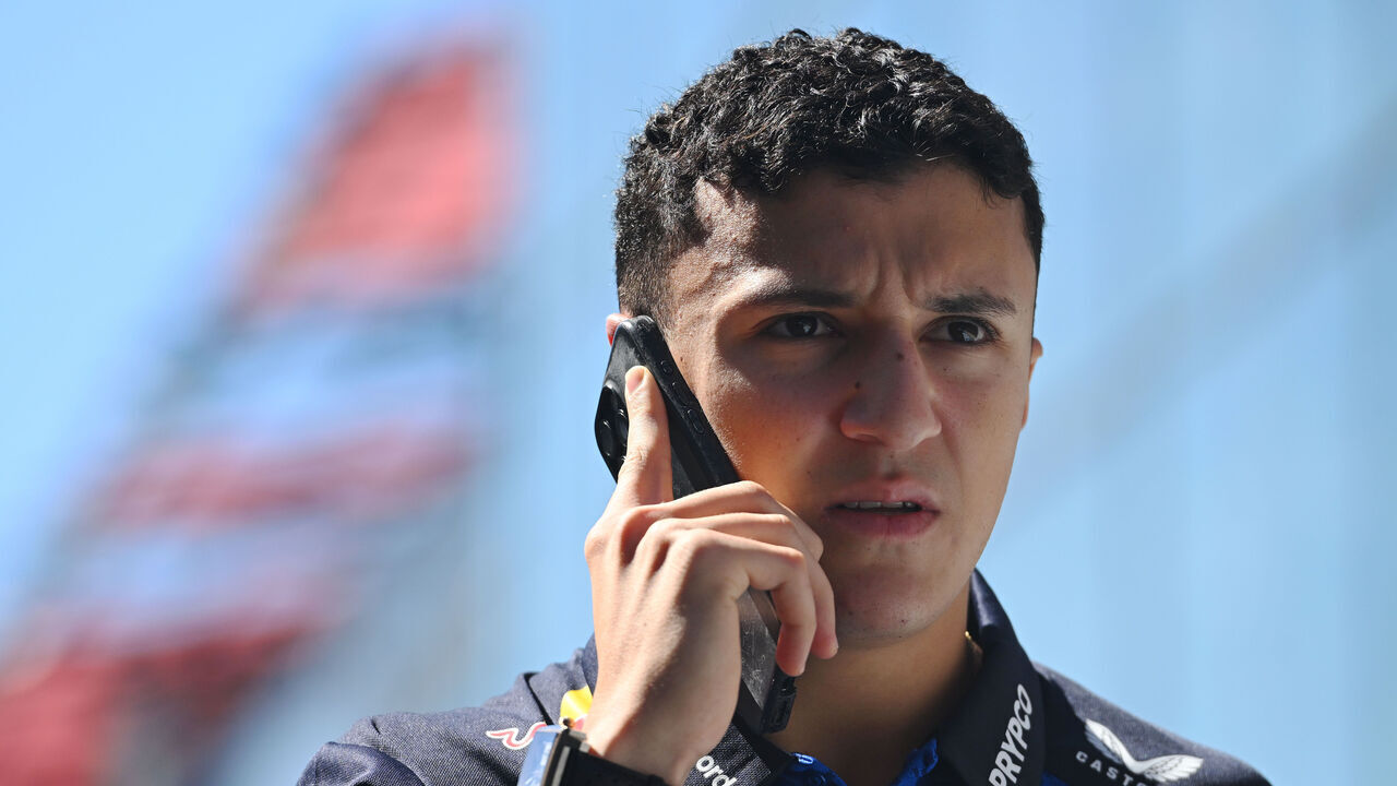 MADRID, SPAIN - SEPTEMBER 10: Isack Hadjar of France and Oracle Red Bull Racing talks on the phone as he walks in the Paddock during previews ahead of the F1 Grand Prix of Spain at Madring on September 10, 2026 in Madrid, Spain.