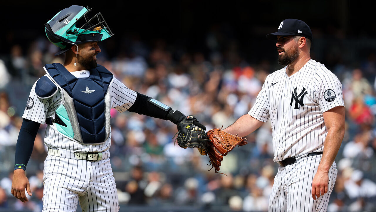 NEW YORK, NY - SEPTEMBER 22: Ali Sánchez #39 and Carlos Rodón #55 of the New York Yankees high five during game one of a doubleheader against the Tampa Bay Rays at Yankee Stadium on September 22, 2026 in New York, New York.