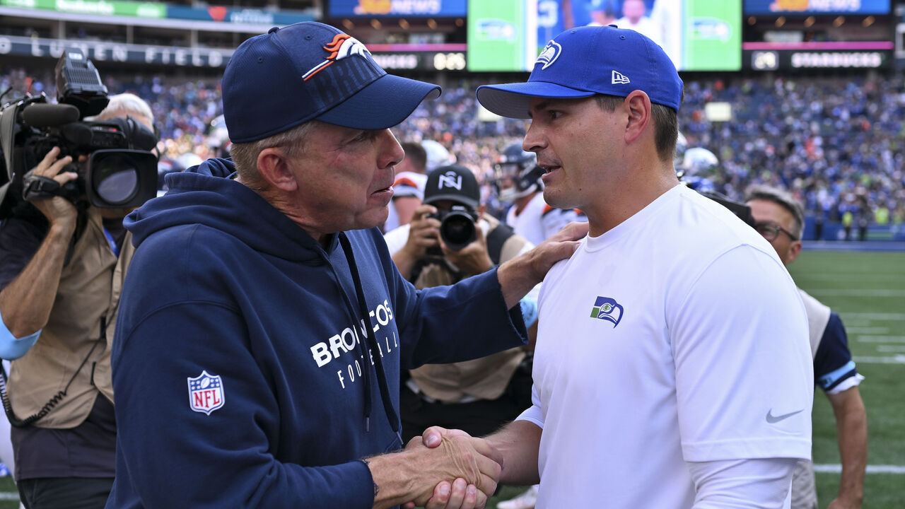 SEATTLE, WASHINGTON - SEPTEMBER 08: Head coach Sean Payton of the Denver Broncos and head coach Mike Macdonald of the Seattle Seahawks shake hands after the game at Lumen Field on September 08, 2024 in Seattle, Washington. The Seahawks defeated the Broncos 26-20.