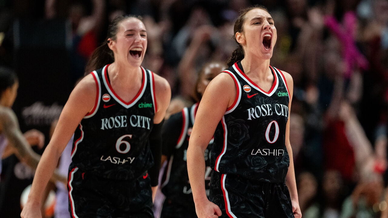 PORTLAND, OREGON - SEPTEMBER 22: Carla Leite #0 and Bridget Carleton #6 of the Portland Fire celebrate a basket by Leite in overtime against the Golden State Valkyries at Moda Center on September 22, 2026 in Portland, Oregon.