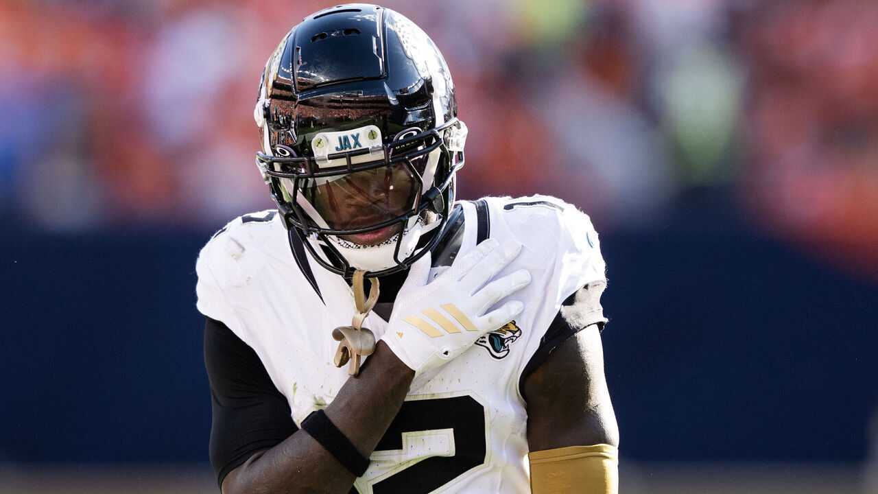 DENVER, CO - SEPTEMBER 20: Cornerback Travis Hunter (12) of the Jacksonville Jaguars adjusts his pads during the second half a 20-13 loss to the Denver Broncos on Sunday, Sept. 20, 2026, at Empower Field at Mile High in Denver, Colo.