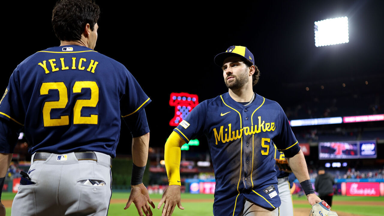 PHILADELPHIA, PA - SEPTEMBER 23: Garrett Mitchell #5 of the Milwaukee Brewers and Christian Yelich #22 celebrate after the Brewers defeated the Philadelphia Phillies at Citizens Bank Park on Wednesday, September 23, 2026 in Philadelphia, Pennsylvania.