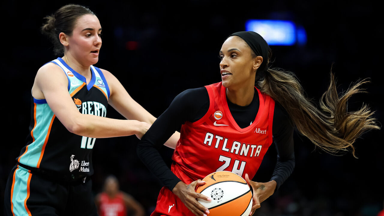 BROOKLYN, NEW YORK - SEPTEMBER 23: DeWanna Bonner #24 of the Atlanta Dream controls the ball against Pauline Astier #18 of the New York Liberty during the second quarter at Barclays Center on September 23, 2026 in Brooklyn, New York.