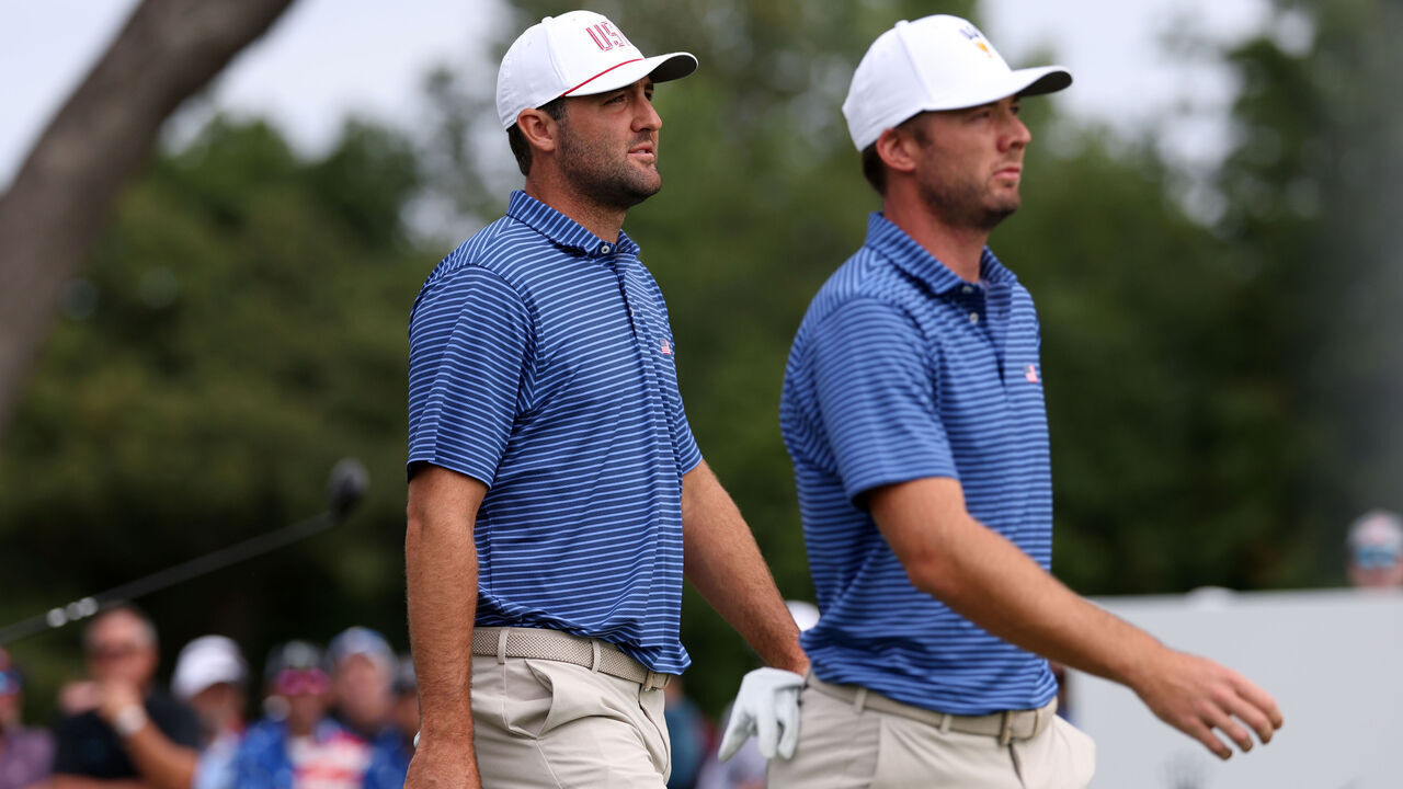 MEDINAH, ILLINOIS - SEPTEMBER 24: Scottie Scheffler of the U.S. Team and Sam Burns of the U.S. Team walk off the second tee during Thursday's Four-ball matches on day one of the Presidents Cup 2026 at Medinah Country Club on September 24, 2026 in Medinah, Illinois.