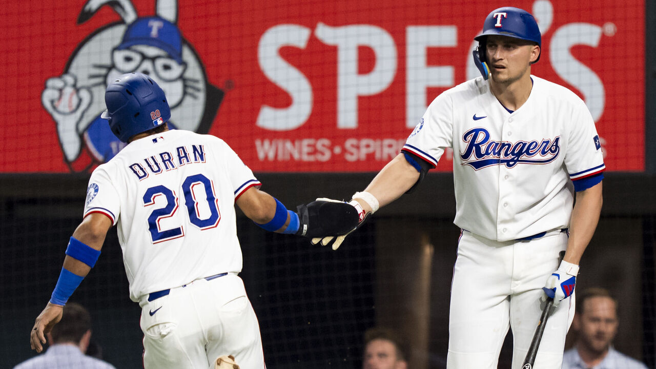 ARLINGTON, TX - SEPTEMBER 22: Ezequiel Duran #20 and Corey Seager #5 of the Texas Rangers celebrate during a game against the New York Mets at Globe Life Field on September 22, 2026 in Arlington, Texas.