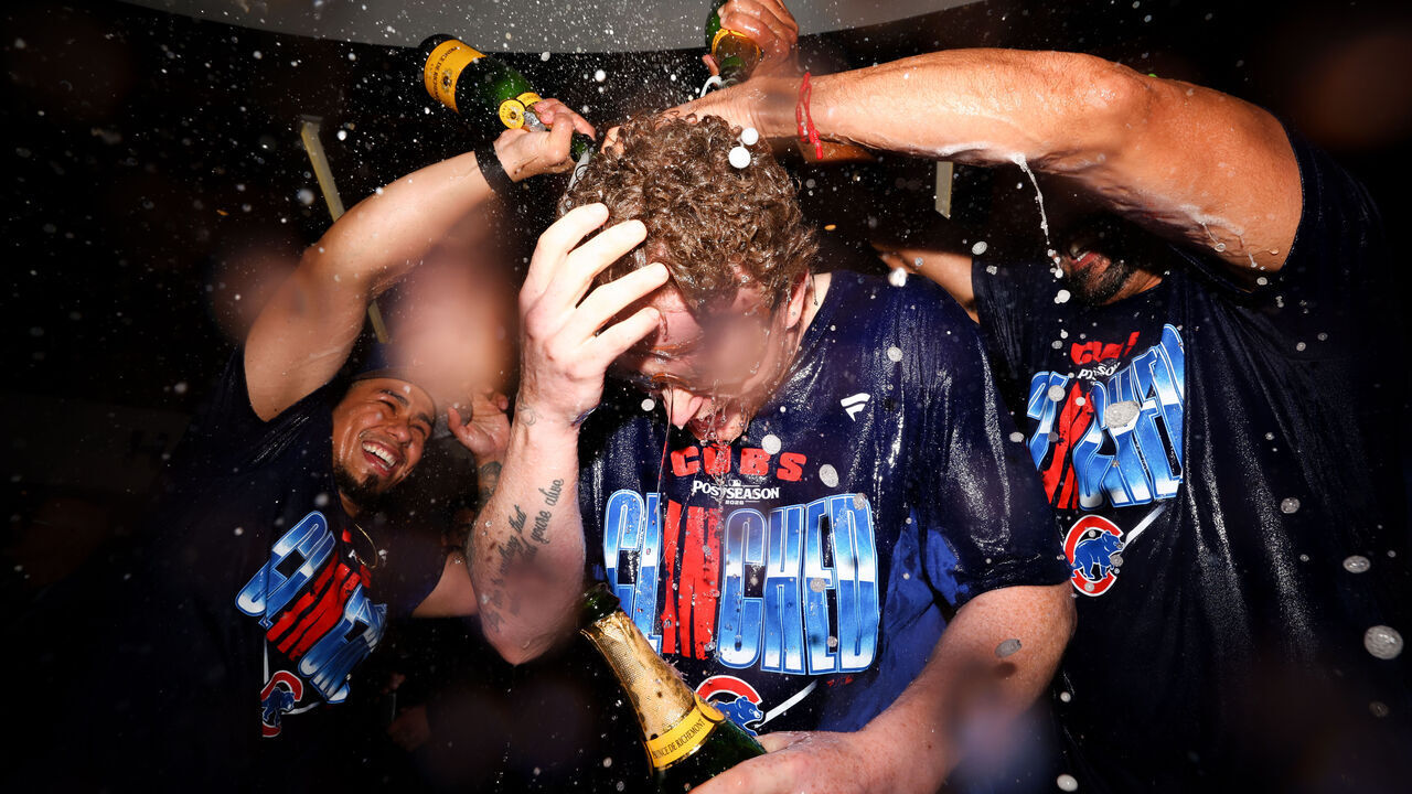 CHICAGO, IL - SEPTEMBER 24: Pete Crow-Armstrong #4 of the Chicago Cubs celebrates with teammates in the clubhouse after defeating the Miami Marlins to clinch a playoff berth at Wrigley Field on Thursday, September 24, 2026 in Chicago, Illinois.