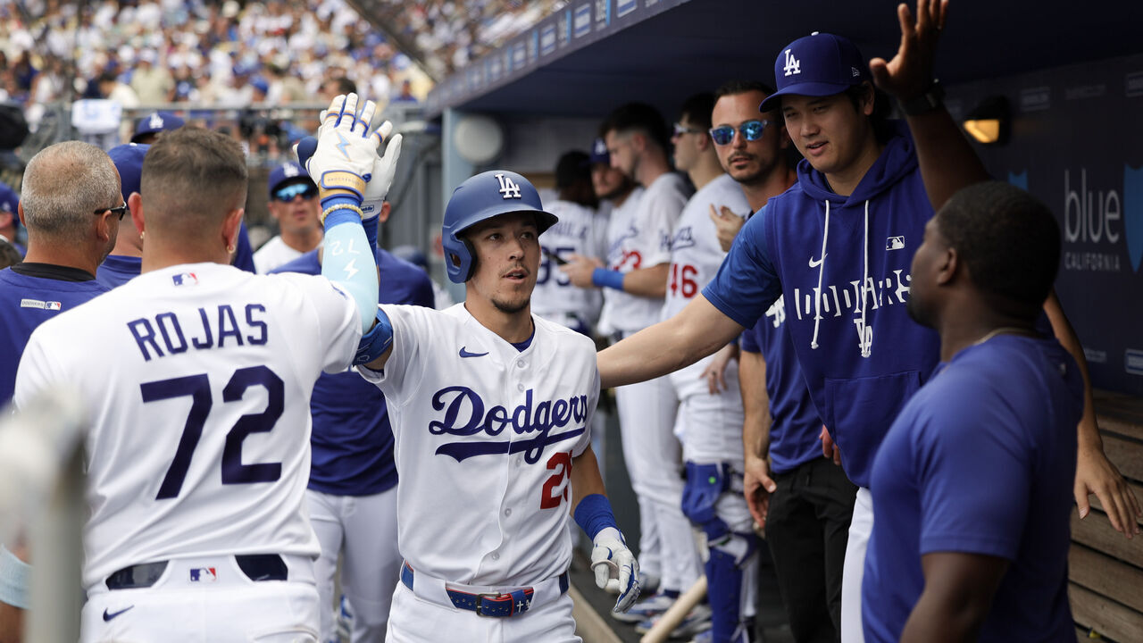 LOS ANGELES, CALIFORNIA - SEPTEMBER 20: Tommy Edman #25 of the Los Angeles Dodgers celebrates in the dugout after hitting a home run during the sixth inning against the San Francisco Giants at Dodger Stadium on September 20, 2026 in Los Angeles, California.