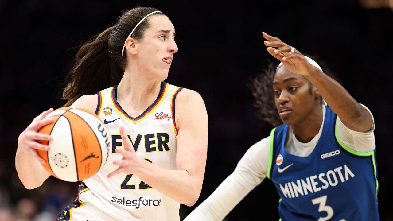 MINNEAPOLIS, MINNESOTA - SEPTEMBER 24: Caitlin Clark #22 of the Indiana Fever goes to the basket against Maya Caldwell #3 of the Minnesota Lynx in the third quarter at Target Center on September 24, 2026 in Minneapolis, Minnesota. The Lynx defeated the Fever 86-66.