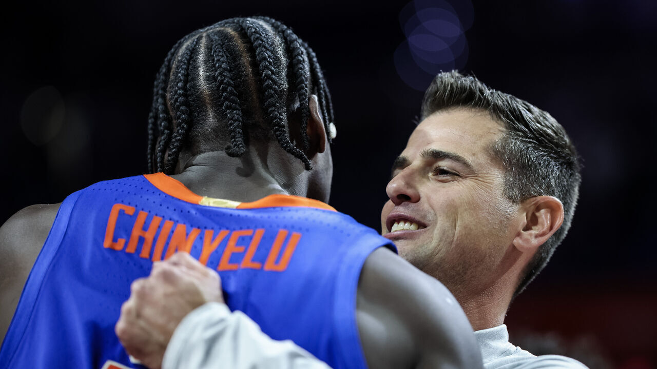 GAINESVILLE, FLORIDA - NOVEMBER 11: Head Coach Todd Golden of the Florida Gators celebrates with Rueben Chinyelu #9 after defeating the Florida State Seminoles 78-76 in a game at the Stephen C. O'Connell Center on November 11, 2025 in Gainesville, Florida.