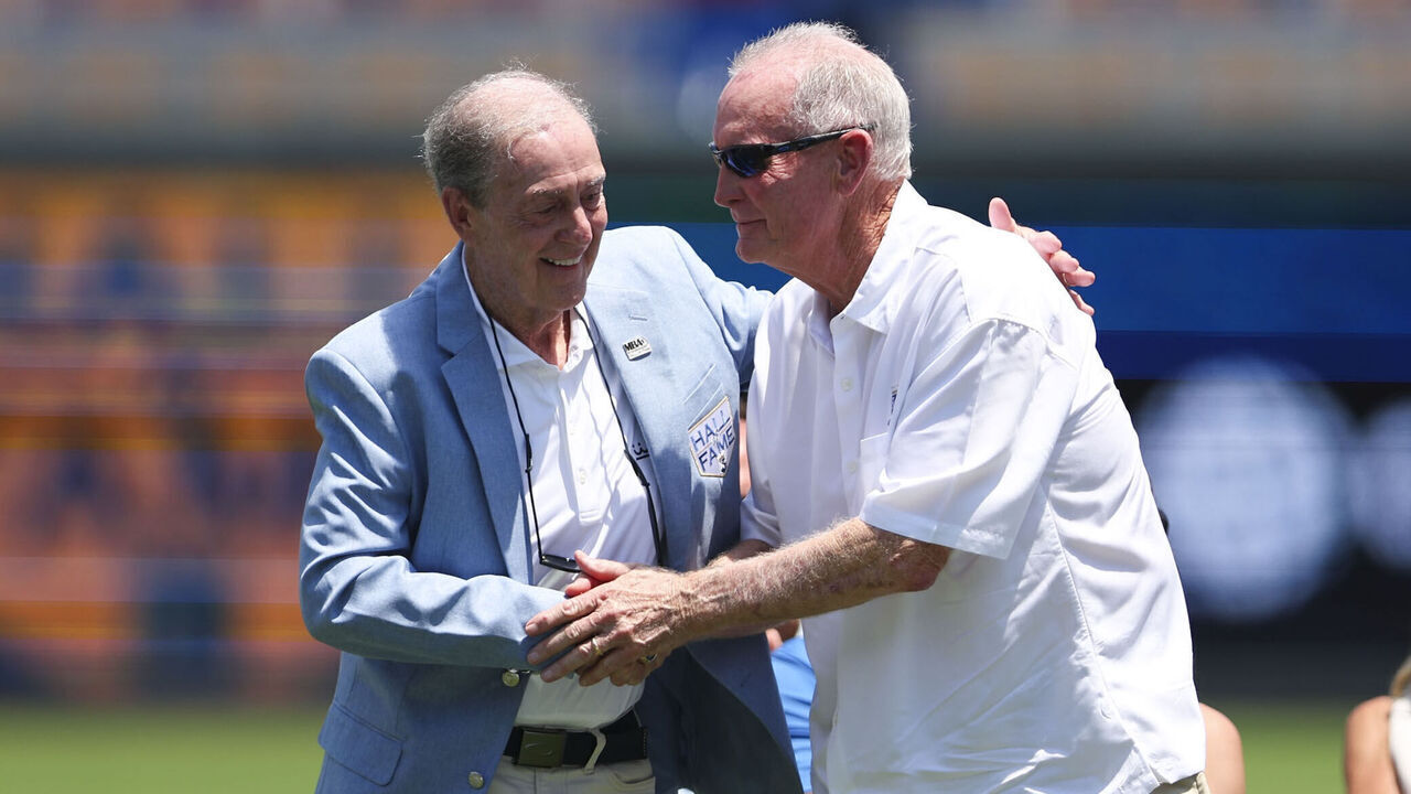 KANSAS CITY, MO - JULY 05: John Wathan (right) shakes hands with Denny Matthews during the Kansas City Royals Hall of Fame induction ceremony prior to the game between the Philadelphia Phillies and the Kansas City Royals at Kauffman Stadium on Sunday, July 5, 2026 in Kansas City, Missouri.
